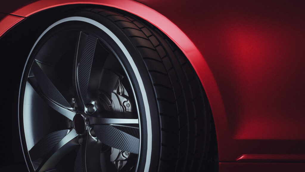 Close-up of a modern luxury car wheels. Red Car. 3d rendering and illustration.